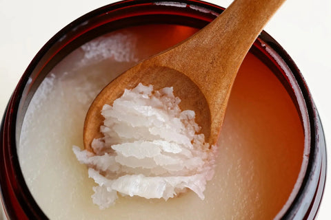 Natural Sea Salt Body Scrub infused with lavender and peppermint for soothing and hydrating skin care.